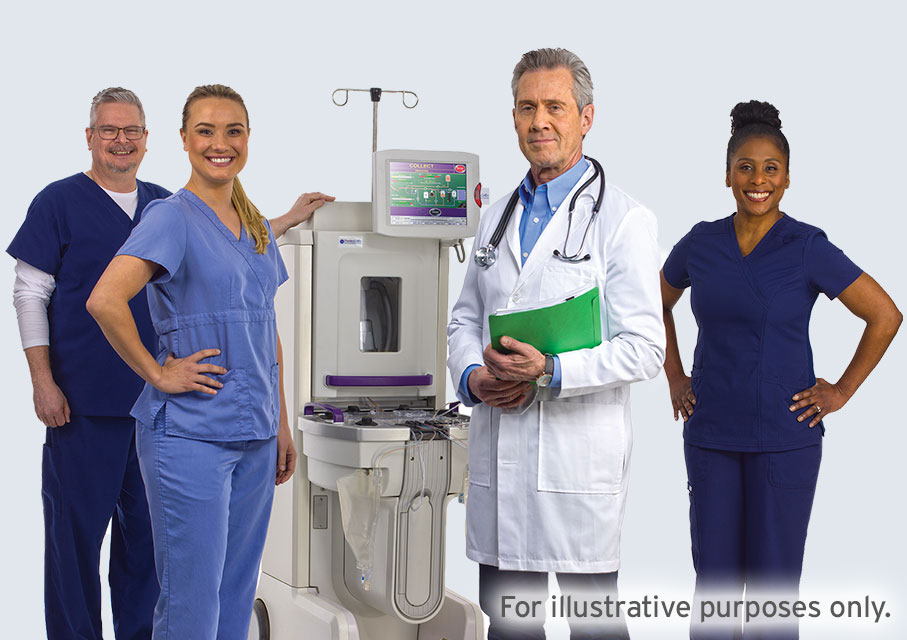 A diverse group of health care professionals standing with a THERAKOS Photopheresis system.